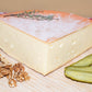 Raclette de Savoie, demi-meule avec noix et cornichons